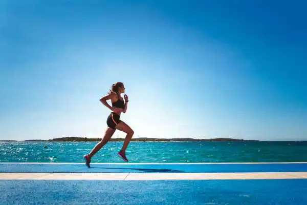 Woman running showing strong leg muscle Rotherham